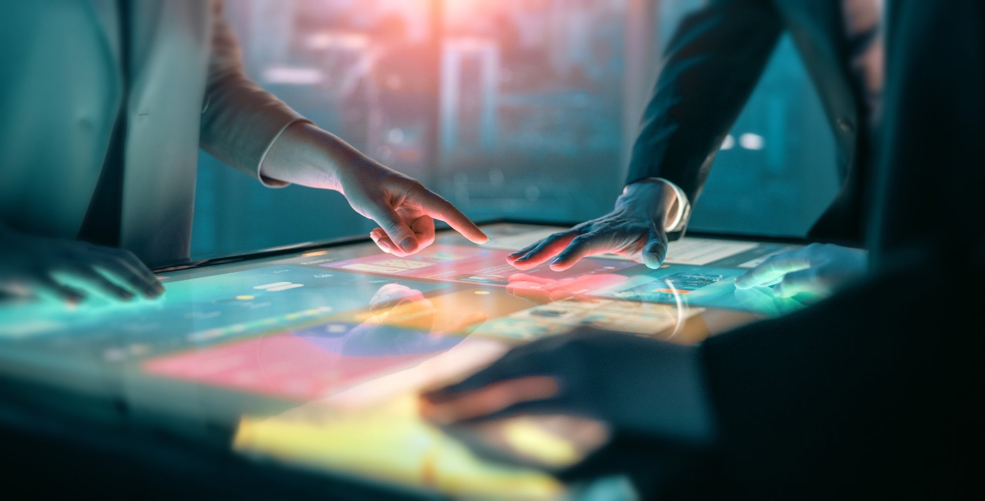 A team working together over an interactive touch table